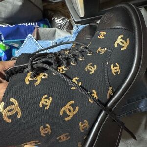 CHANEL Black Boots with Gold Logo Pattern